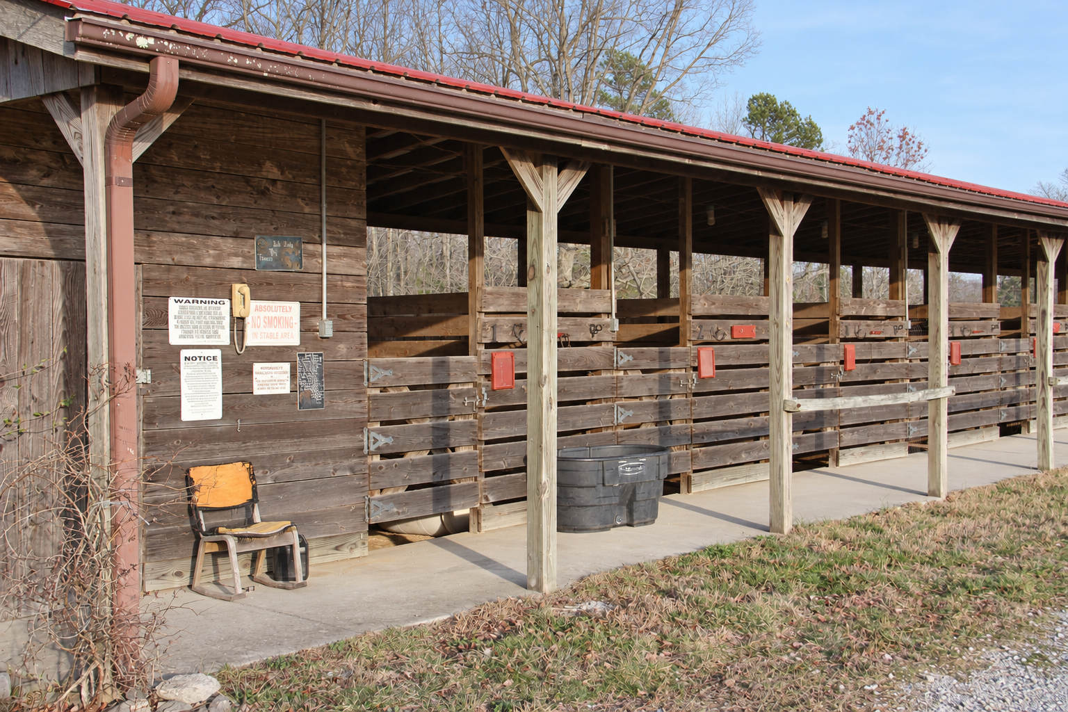 Covered wooden horse stalls at Laurel Creek