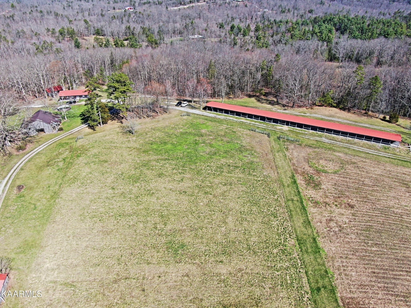 Aerial view of the entire 26-stall barn and surrounding pasture